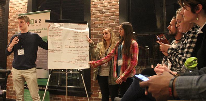 Business students from Susquehanna and Bucknell universities pitch to small business owners at Iron Front in Lewisburg.